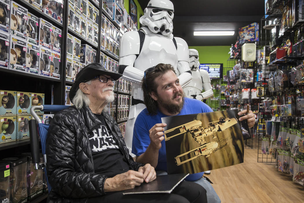 Colin Cantwell, left, concept artist and model builder for the original Star Wars movies, takes ...