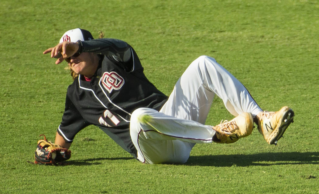 Desert Oasis' Josh Sharman (11) makes a sliding catch versus Reno during their Class 4A state b ...