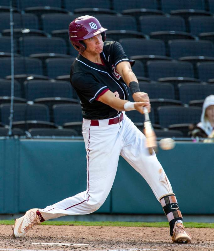 Desert Oasis' Zac Czerniawski (8) connects on a pitch from Reno during their Class 4A state bas ...