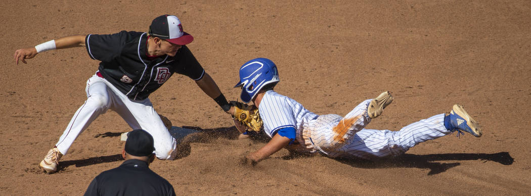 Desert Oasis' Zac Czerniawski (8) tags out Reno's Gunner Gouldsmith (8) attempting to steal sen ...