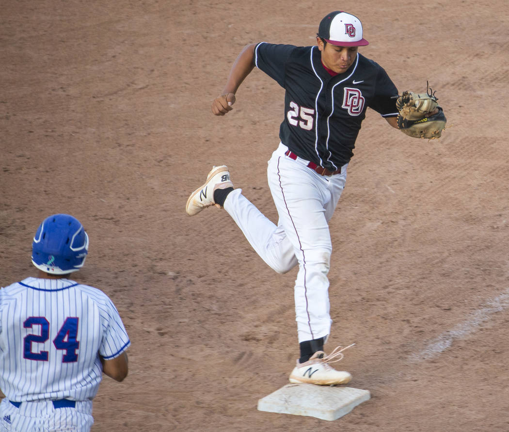 Desert Oasis' Aaron Roberts (25) makes the final out at first base over Reno's Skylar Hales (24 ...