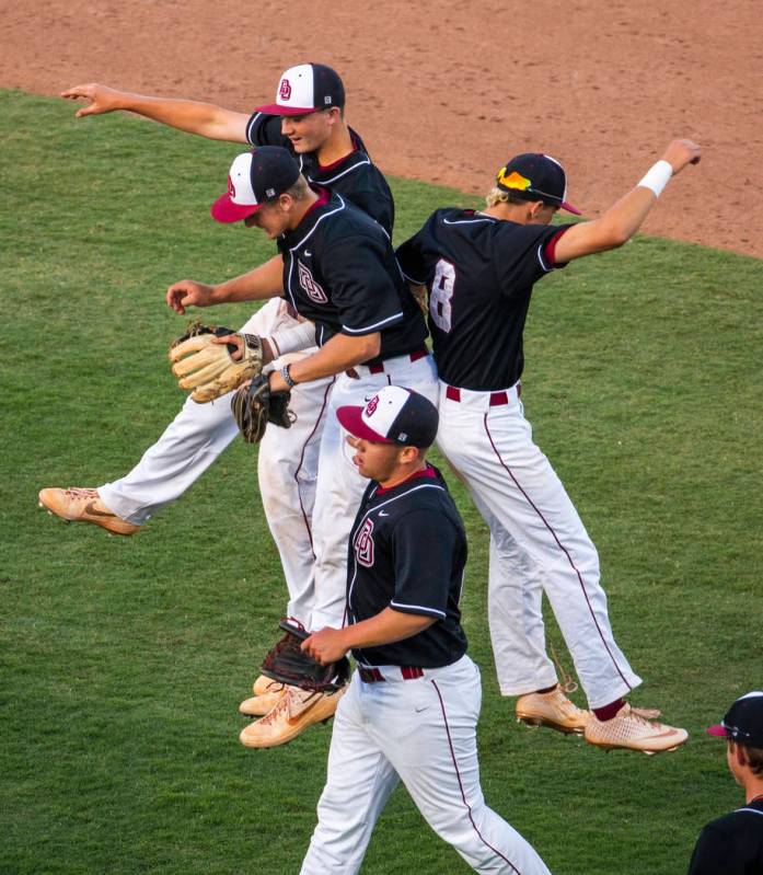 Desert Oasis players celebrate their win over Reno 8-6 following their Class 4A state baseball ...