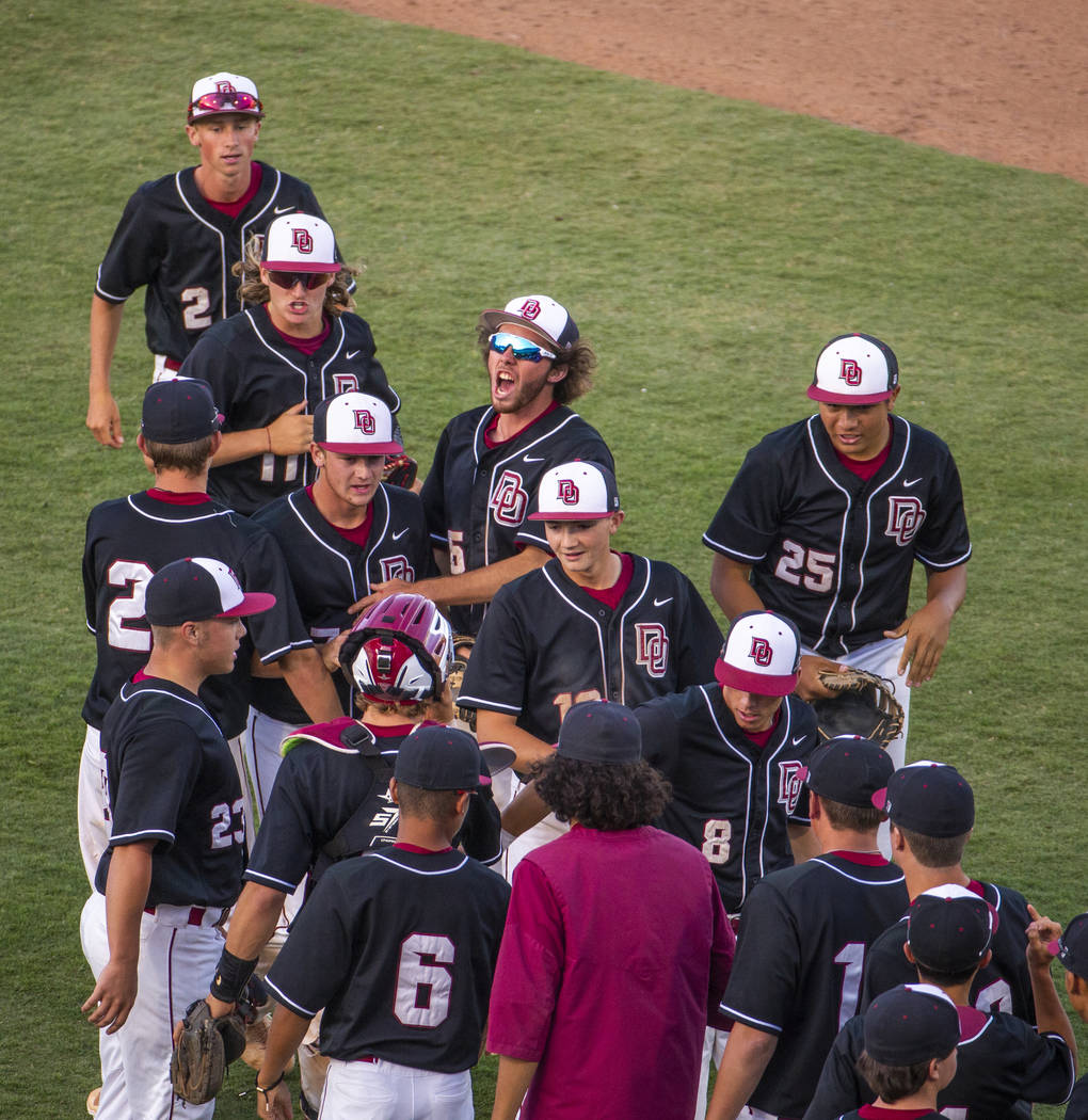 Desert Oasis players celebrate their win over Reno 8-6 following their Class 4A state baseball ...