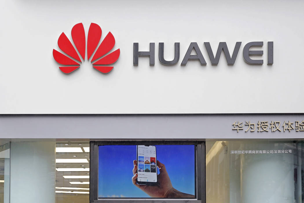 A logo of Huawei is displayed March 7, 2019, at a shop in Shenzhen, China's Guangdong province. ...