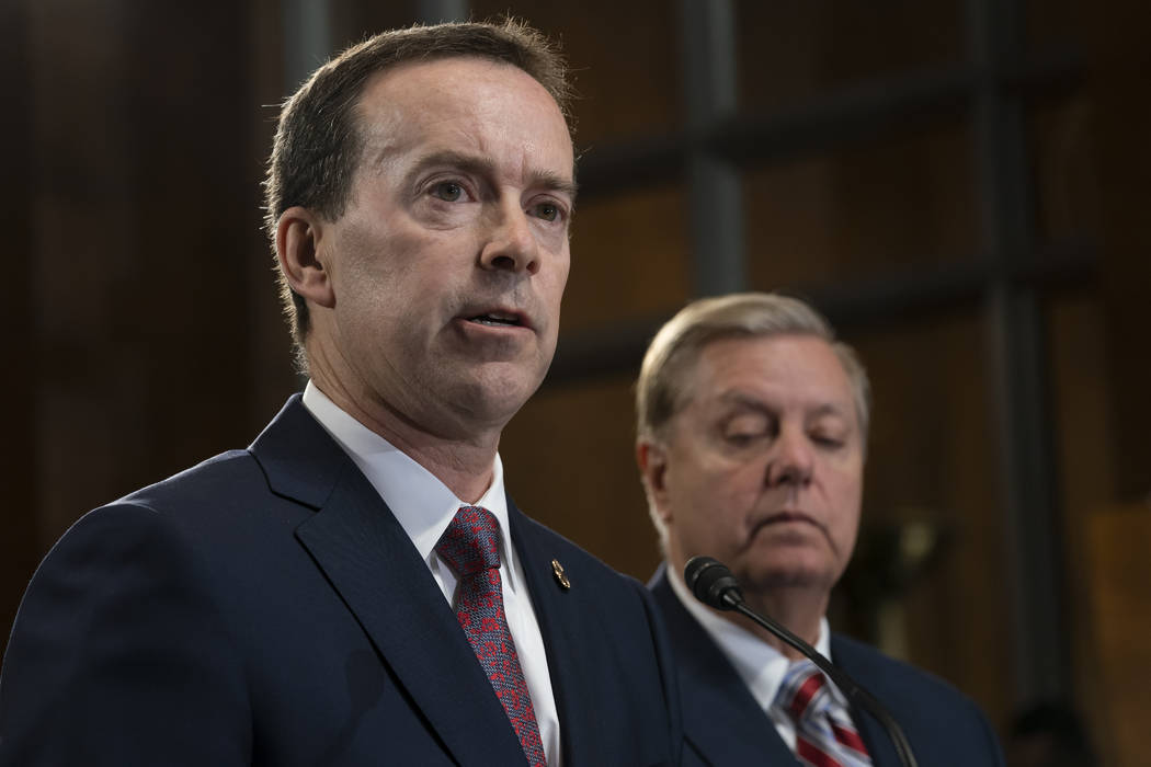 Acting U.S. Customs and Border Protection Commissioner John Sanders, left, joins Senate Judicia ...