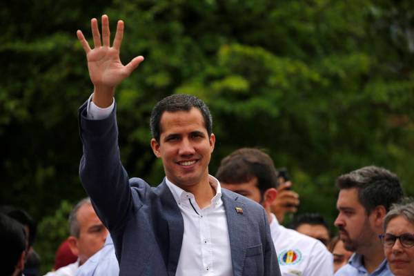 Opposition leader Juan Guaidó greets supporters at a rally in Caracas, Venezuela, Saturday ...