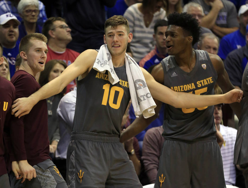 Arizona State forward Vitaliy Shibel (10) holds back a bench celebration during the second half ...