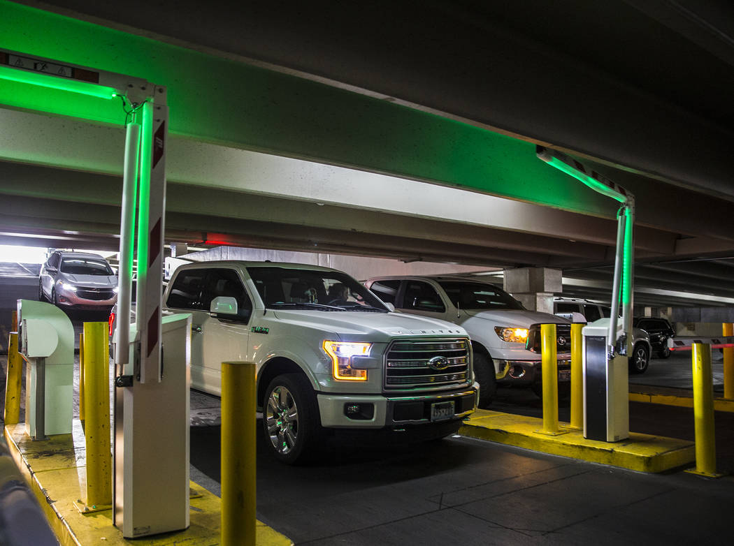 Guests pay for parking at the Caesars Palace garage on Thursday, May 16, 2019, in Las Vegas. (L ...