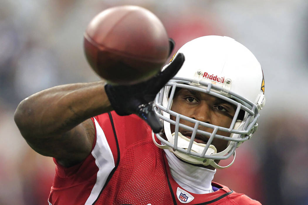 In this Sunday, Jan. 1, 2012 file photo, Arizona Cardinals' Patrick Peterson warms up prior to ...