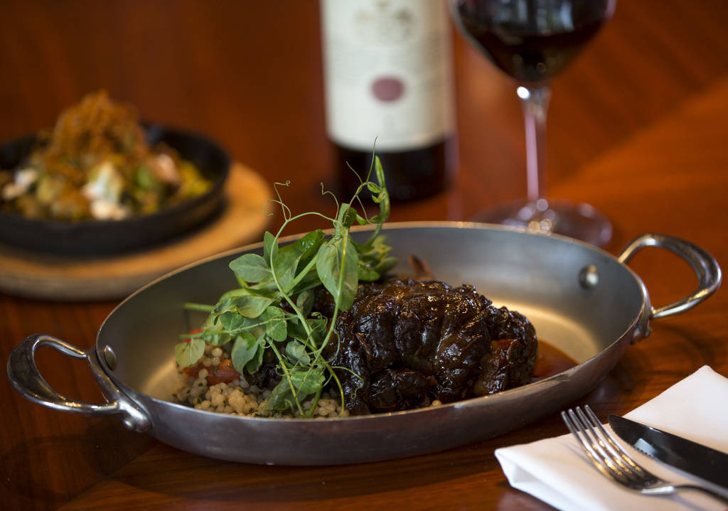 Lamb shank with Sardinian couscous, radicchio and anchovy lemon vinaigrette at Masso Osteria in ...