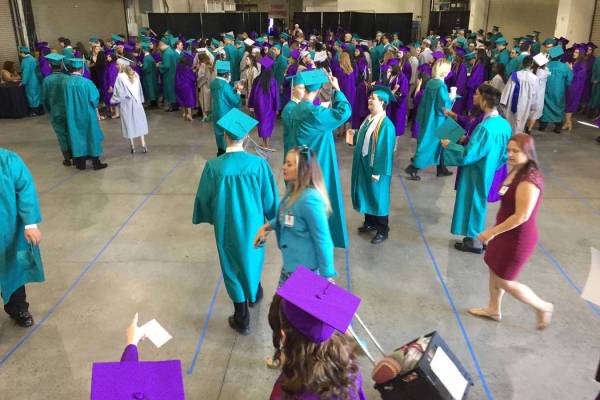 Silverado High School students congregate in a back room at Orleans Arena before graduation Wed ...