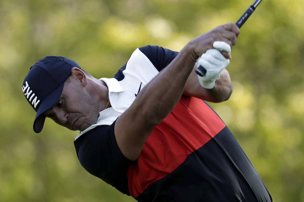 Brooks Koepka hits a drive off the 13th tee during the first round of the PGA Championship golf ...