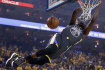 Golden State Warriors forward Draymond Green dunks against the Portland Trail Blazers during th ...