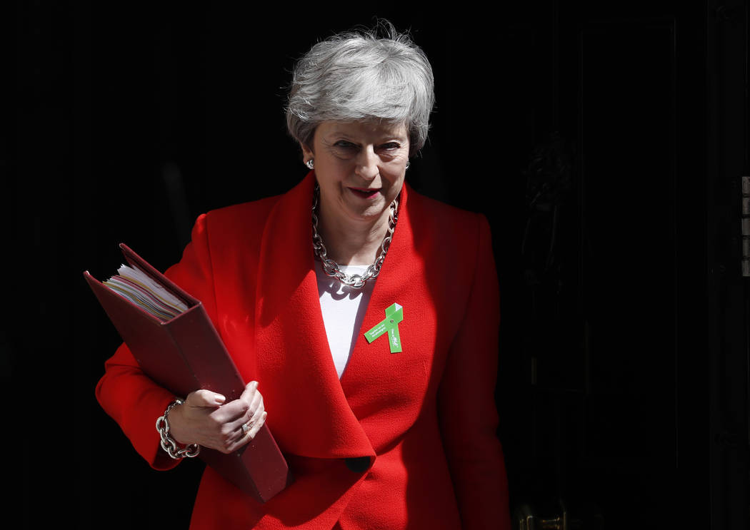 Britain's Prime Minister Theresa May leaves 10 Downing Street for her weekly Prime Minister's Q ...