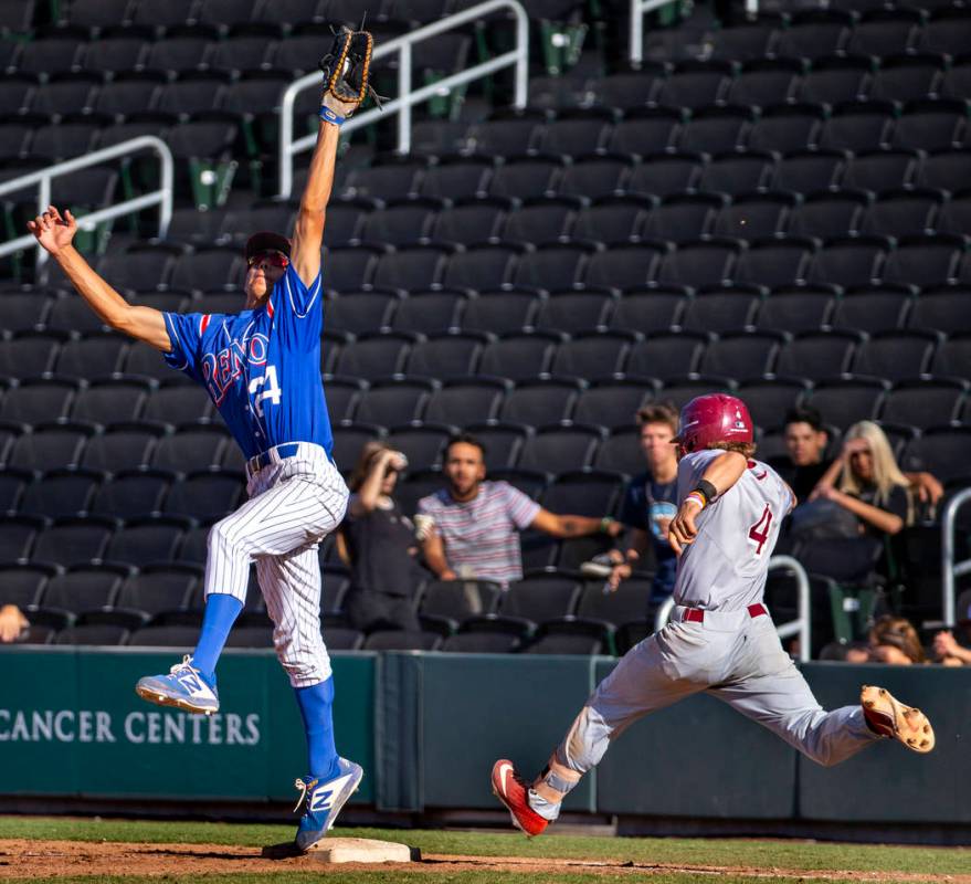 Reno's Skylar Hales (24) extends for a tough catch at first base make the out over Desert Oasis ...