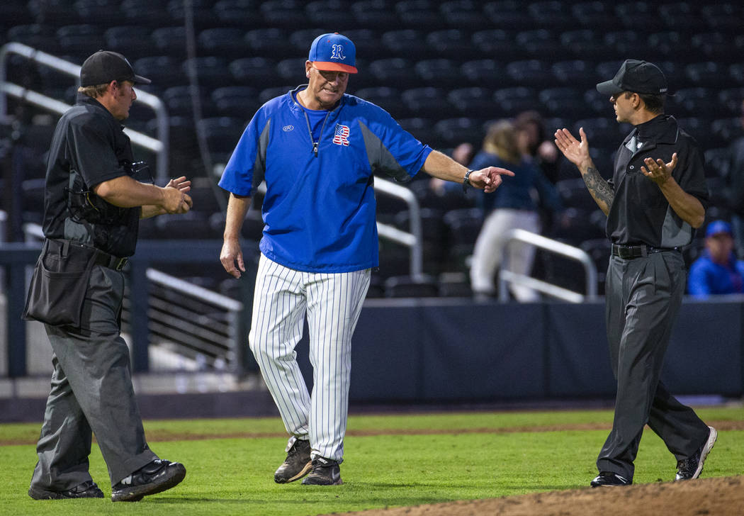 Reno head coach Pete Savage argues a call with the umpires versus Desert Oasis in the third inn ...