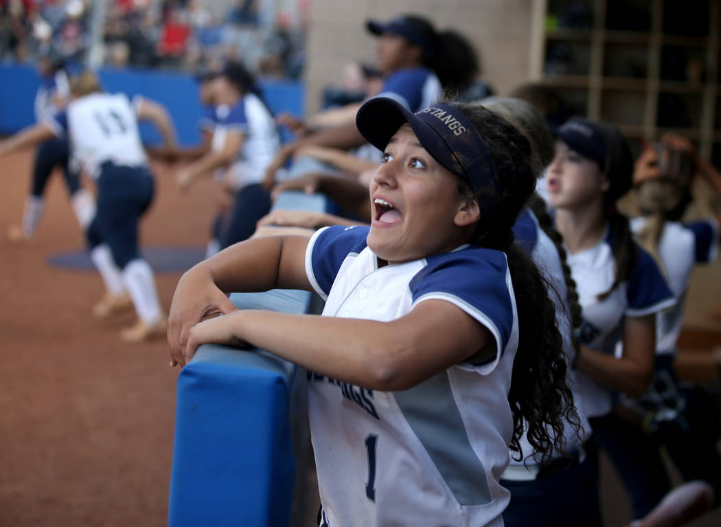 Shadow Ridge players including Kyanna Galvan (1) celebrate the go-ahead home run by Shea Clemen ...