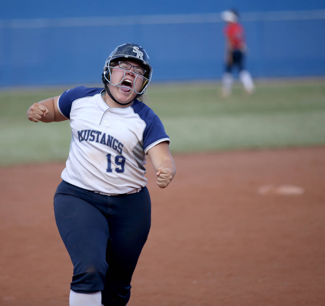 Shadow Ridge Sydney Morgan (19) celebrates her three-run home run against Coronado in their Cla ...