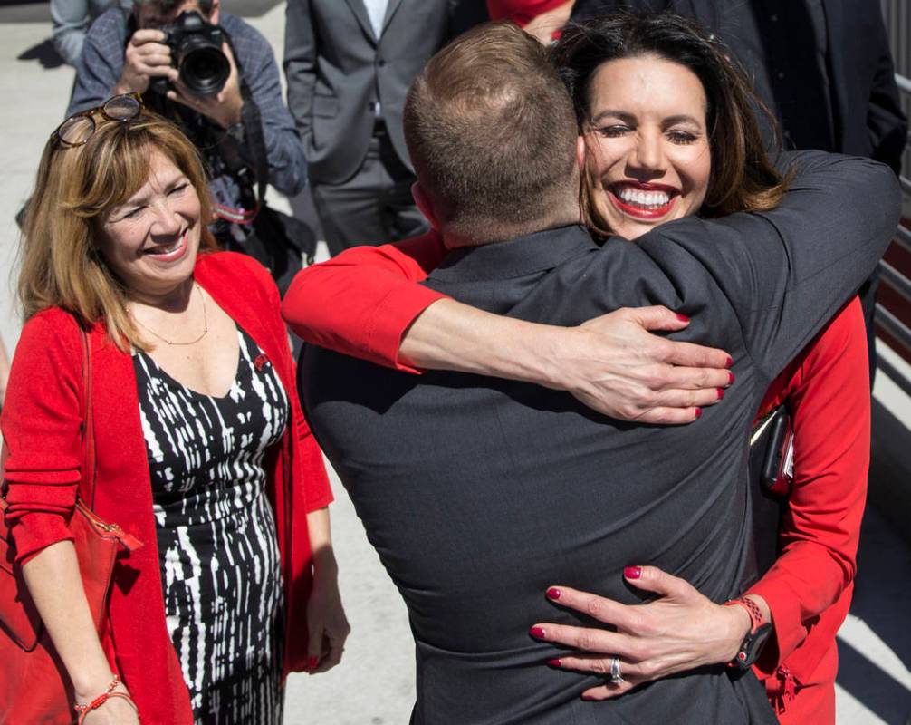 UNLV athletic director Desiree Reed-Francois, right, hugs new UNLV men's basketball coach T.J. ...