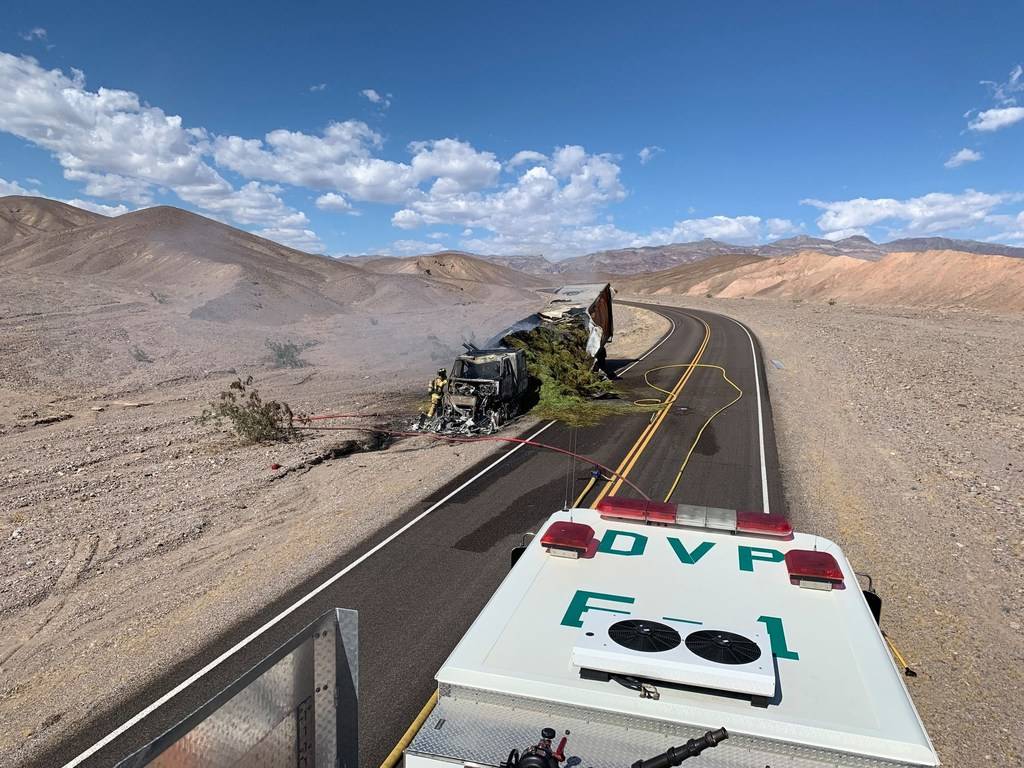 A hay truck burns in Death Valley National Park after the driver took a wrong turn and drove do ...