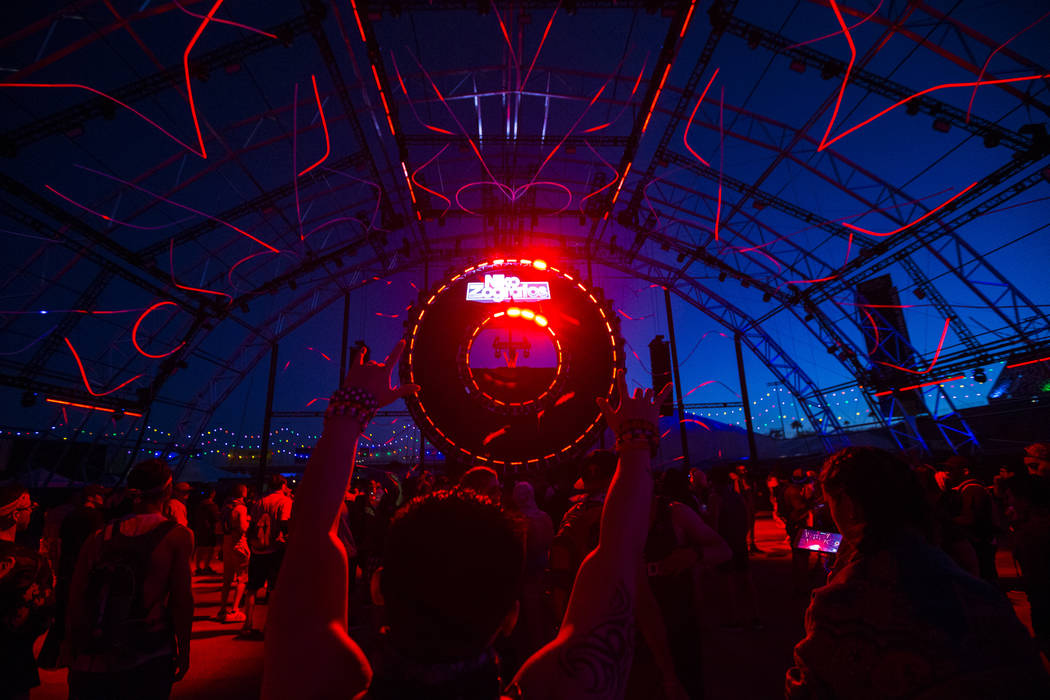 Attendees cheer as Niko Zografos performs at the Quantum Valley stage during the first day of t ...