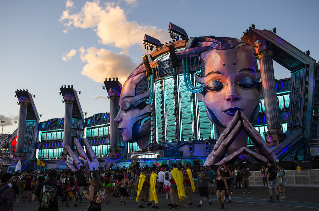 Attendees stand by the Kinetic Field stage during the first day of the Electric Daisy Carnival ...