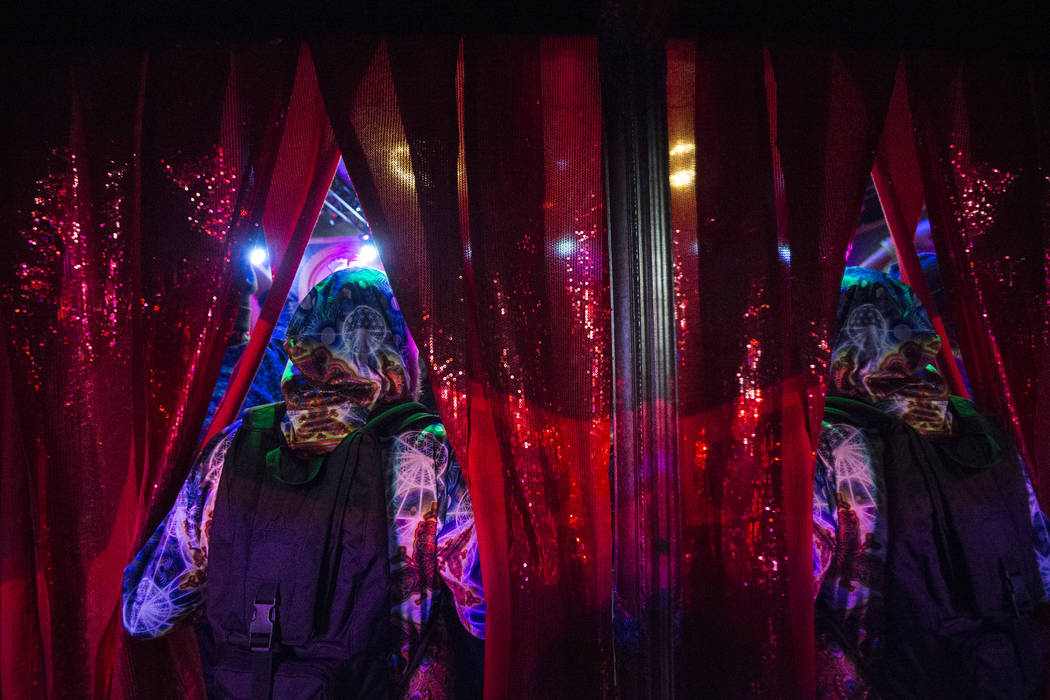 Attendees walk into The Queen bar and dance room during the first day of the Electric Daisy Car ...