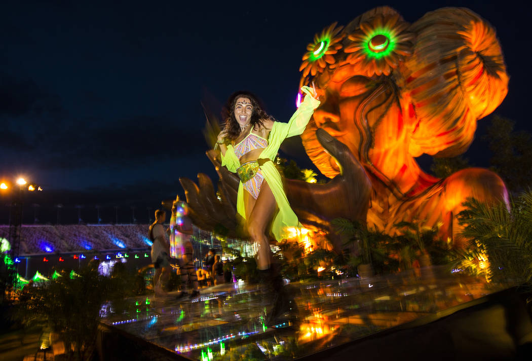 Sofia Alengoz, of Las Vegas, dances by the Anima installation during the second day of the Elec ...