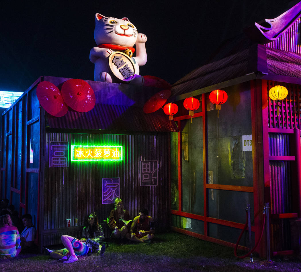 Attendees relax by the Tokyo Karaoke Bar during the second day of the Electric Daisy Carnival a ...