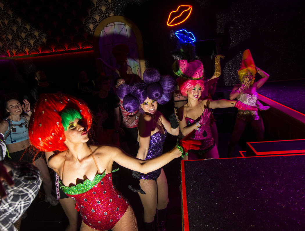 Costumed performers dance at The Queen in Downtown EDC at during the second day of the Electric ...