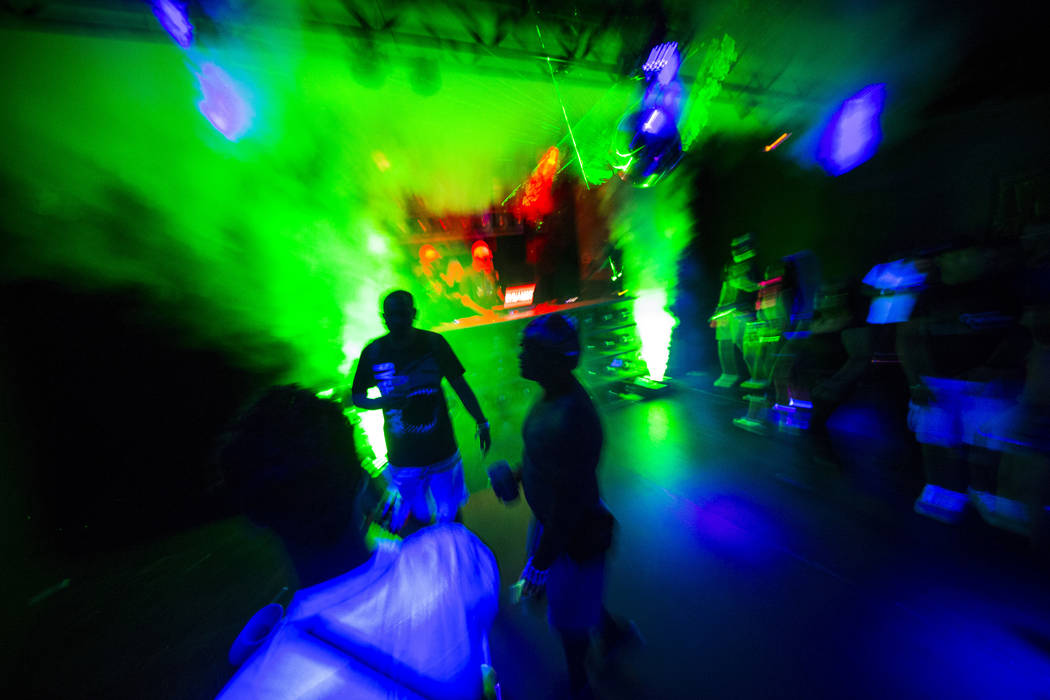 Attendees dance at the Headlight in Downtown EDC during the second day of the Electric Daisy Ca ...