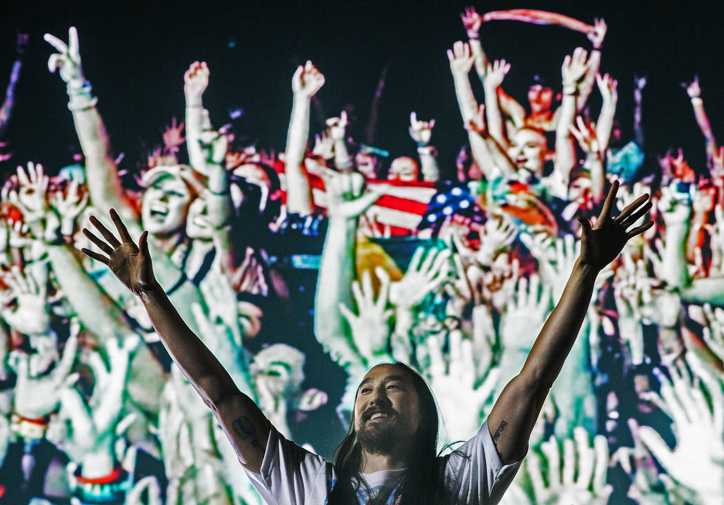 Steve Aoki pumps up the crowd during his performs at the Circuit Grounds stage on day three of ...