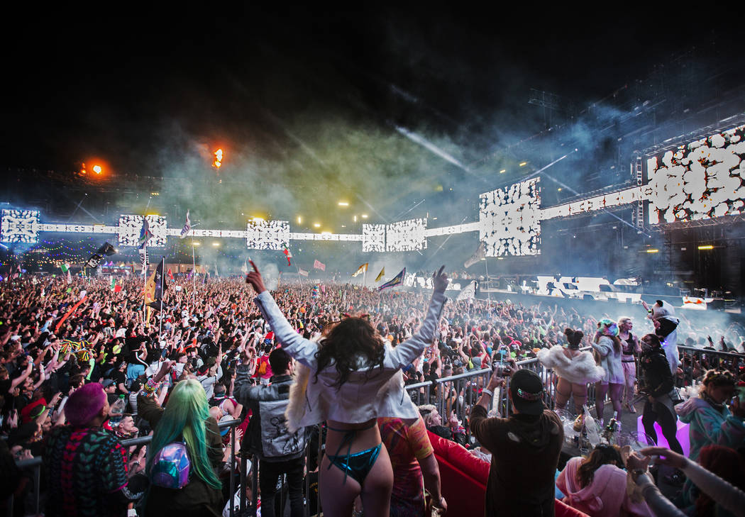 Concert goers cheer for Steve Aoki during his performance at the Circuit Grounds stage on day t ...