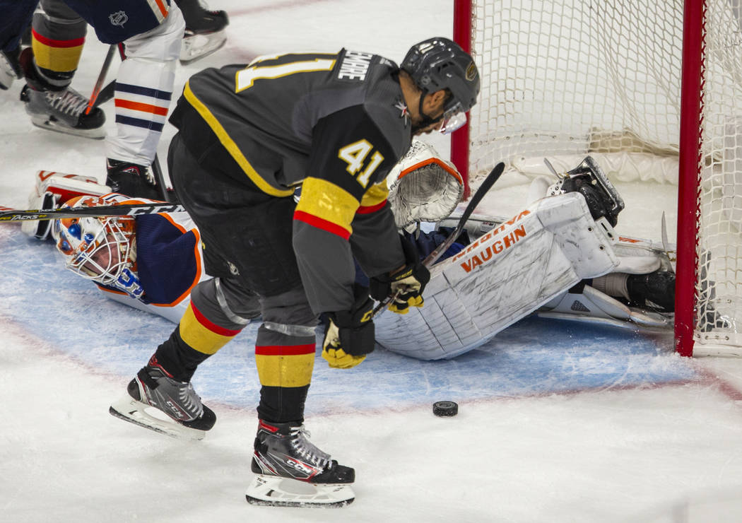 Edmonton Oilers goaltender Mikko Koskinen (19) is down on the ice as Vegas Golden Knights cente ...