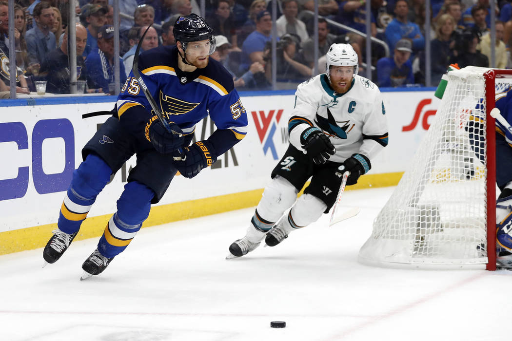 St. Louis Blues defenseman Colton Parayko (55) and San Jose Sharks center Joe Pavelski (8) chas ...