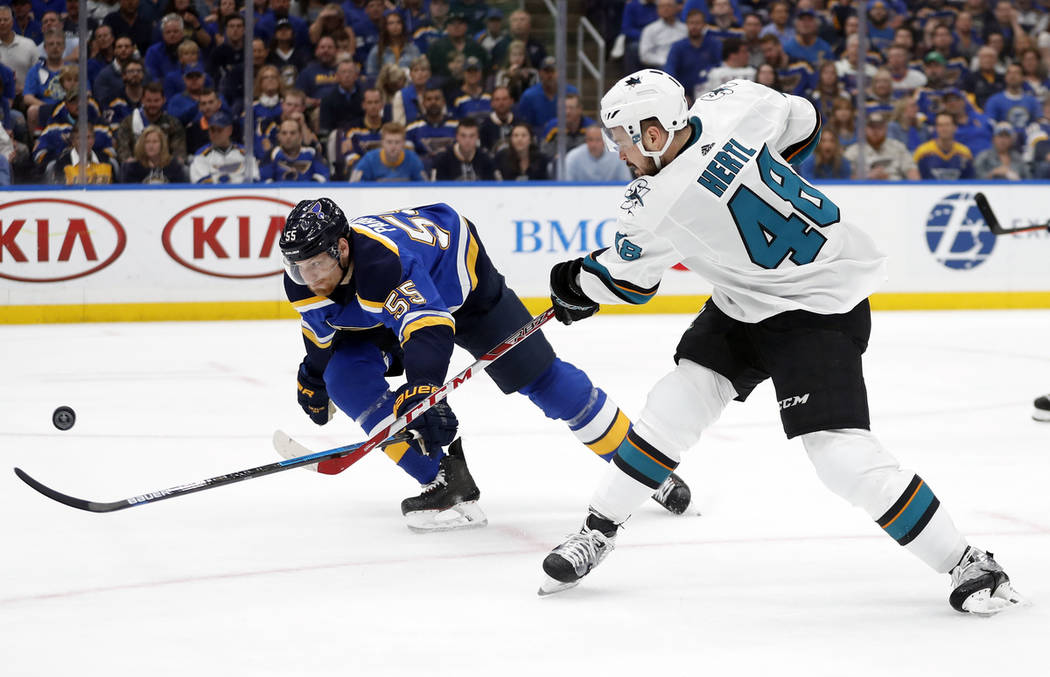 St. Louis Blues defenseman Colton Parayko (55) tries to block the shot of San Jose Sharks cente ...