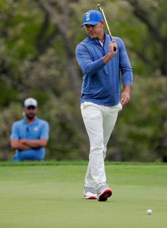 Brooks Koepka reacts after missing a putt on the fourth green during the second round of the PG ...