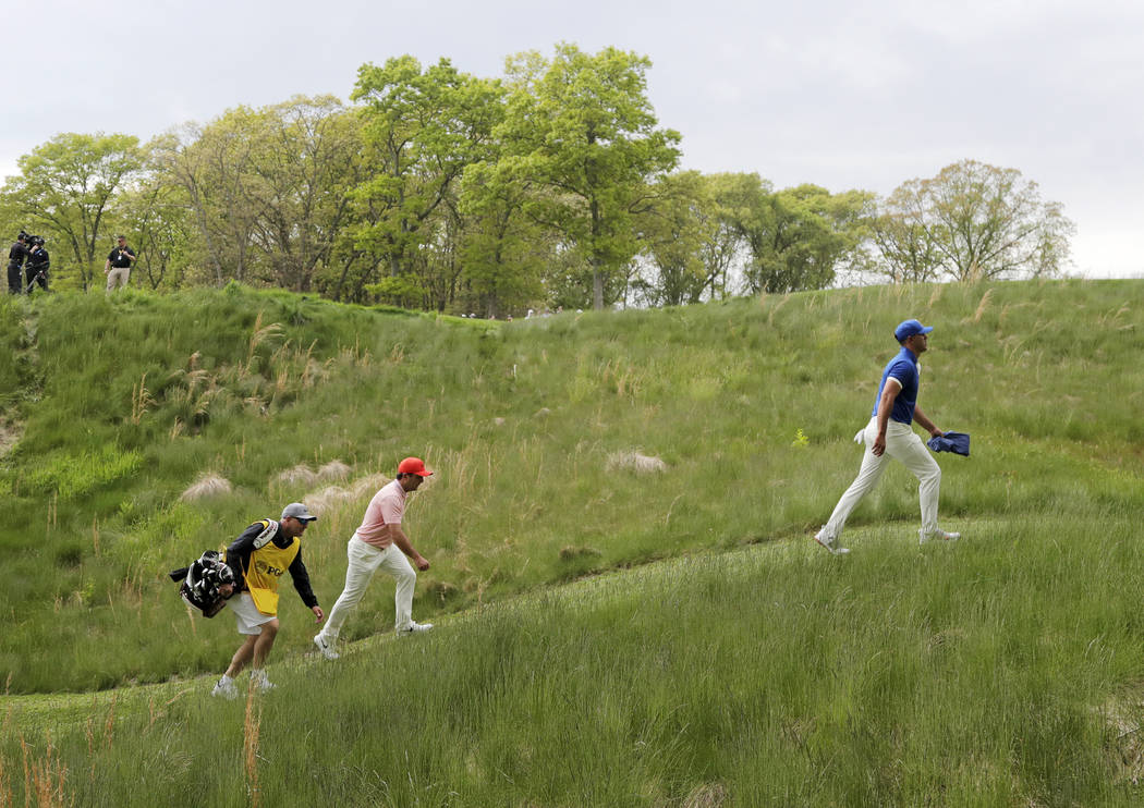 Brooks Koepka walks to the ninth tee during the second round of the PGA Championship golf tourn ...