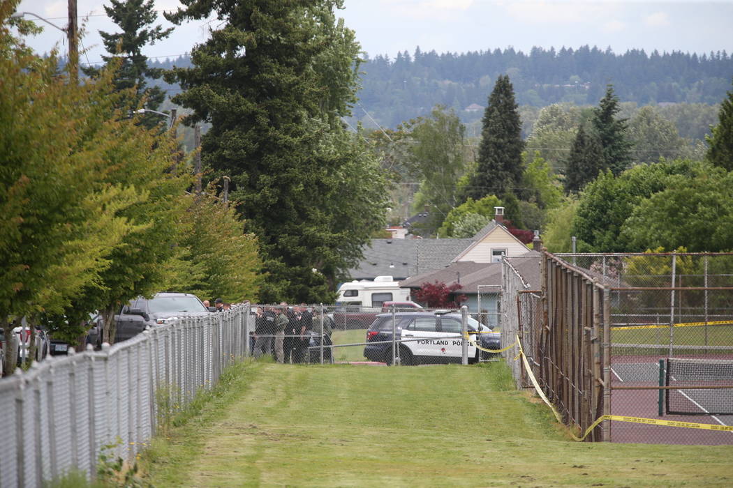 Police are positioned outside Parkrose High School Parkrose High School during a lockdown after ...