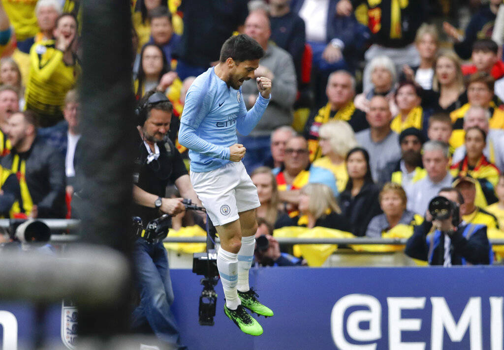 Manchester City's David Silva celebrates after scoring his side's first goal during the English ...