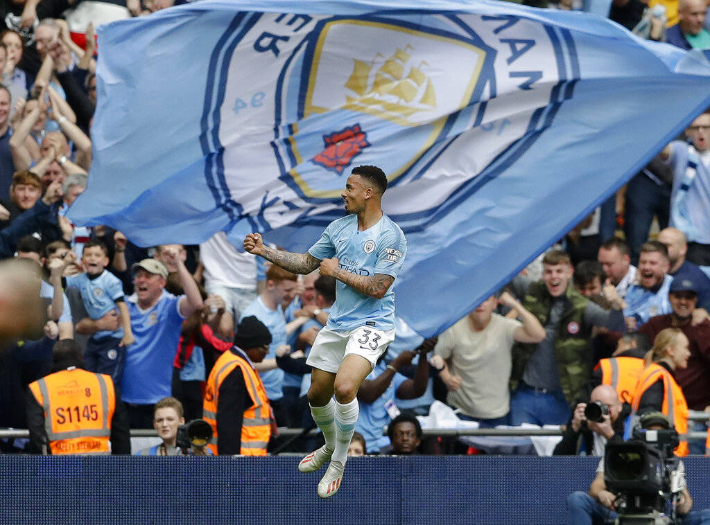 Manchester City's Gabriel Jesus celebrates after scoring his side's fourth goal during the Engl ...