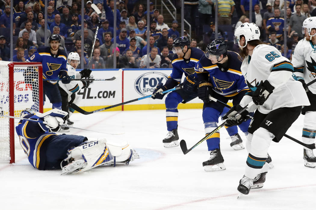 San Jose Sharks defenseman Erik Karlsson (65), of Sweden, scores the winning goal past St. Loui ...