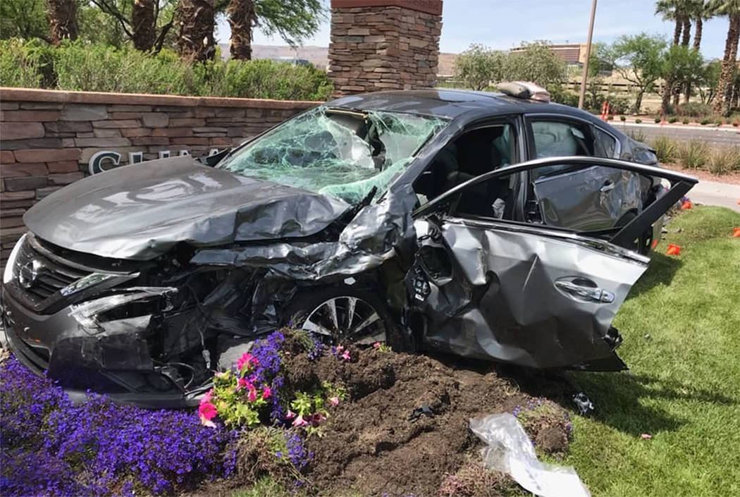 A car is seen at the site of a fatal crash at West Charleston Boulevard and South Town Center D ...