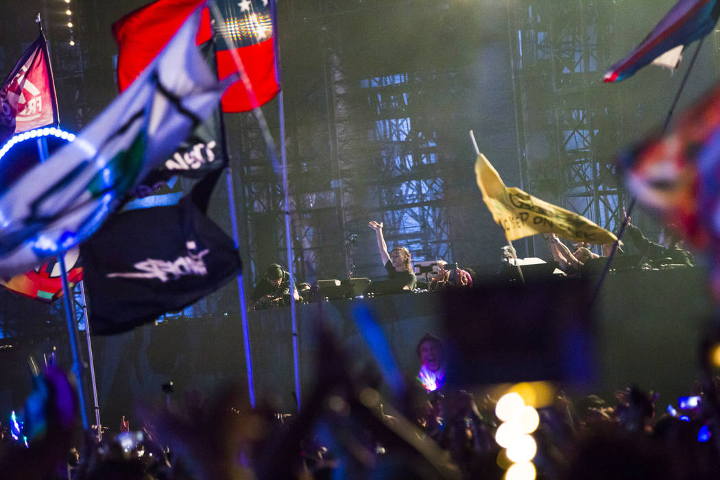 Skrillex performs during a surprise set at the Circuit Grounds stage during the second day of t ...