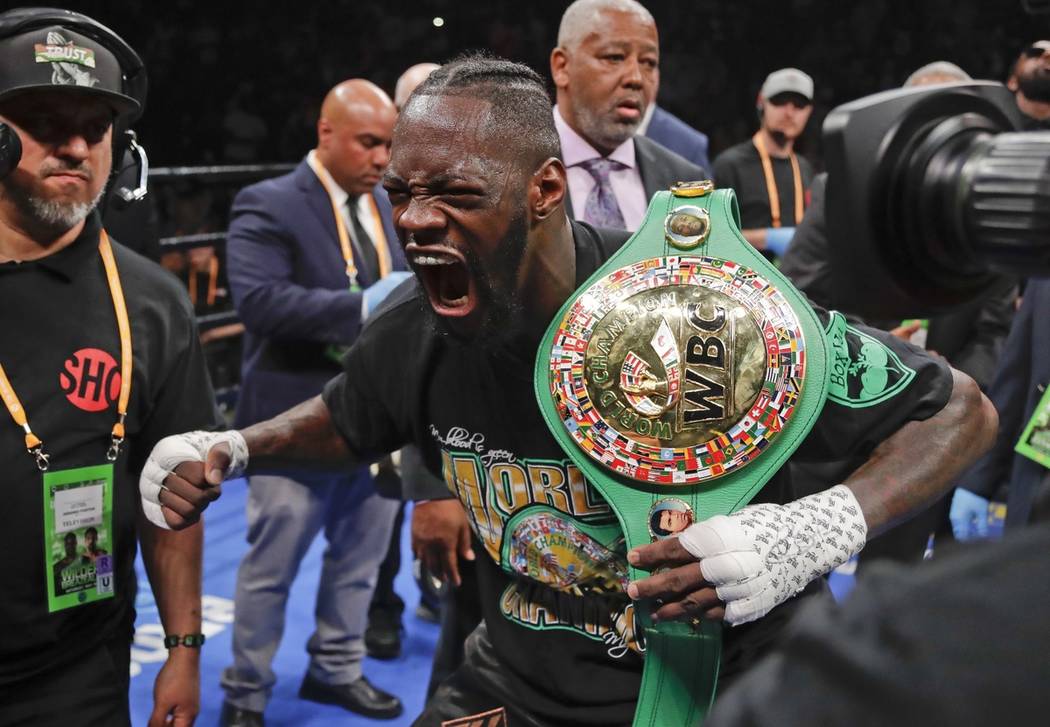 Deontay Wilder poses for photographers after his win in the WBC heavyweight championship boxing ...