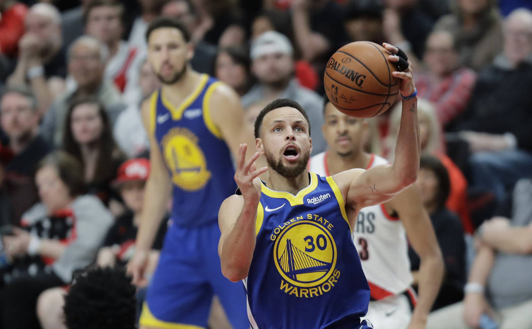 Golden State Warriors guard Stephen Curry shoots during the second half of Game 3 of the NBA ba ...