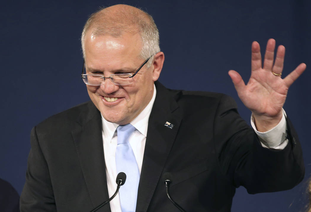 Australian Prime Minister Scott Morrison speaks to party supporters after his opponent concedes ...