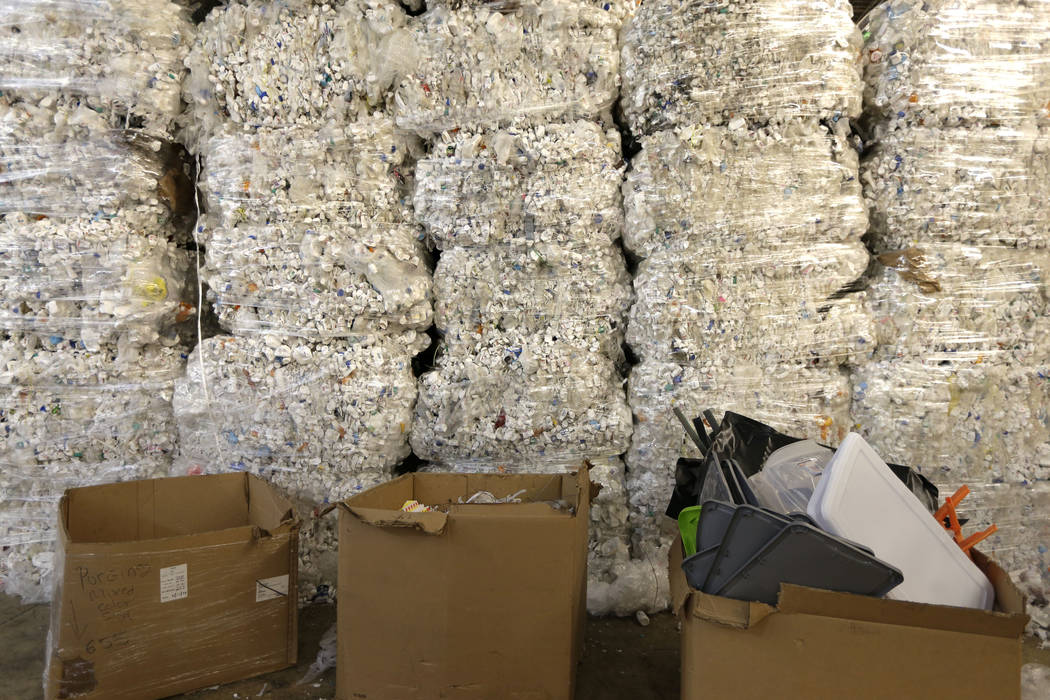 In this May 7, 2019 photo, plastic pill bottles are bundled for recycling at a GDB Internationa ...