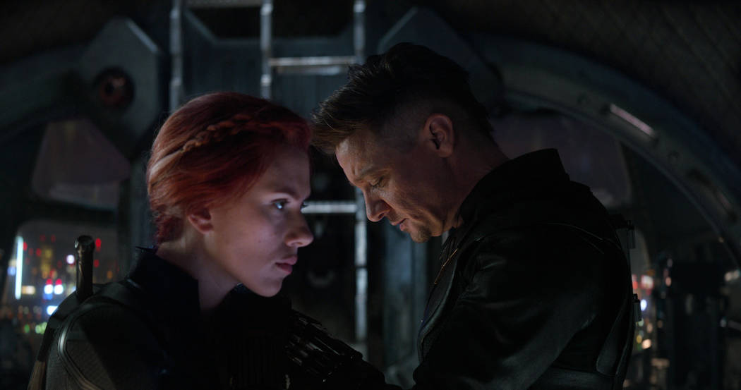 This image released by Disney shows Scarlett Johansson, left, and Jeremy Renner in a scene from ...