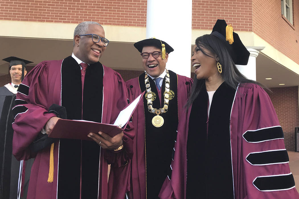 Robert F. Smith, left, laughs with David Thomas, center, and actress Angela Bassett at Morehous ...